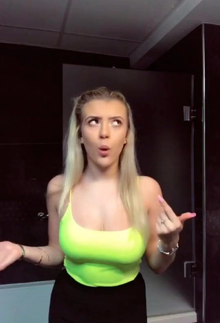 1. Hot Molly Marsh Shows Cleavage in Yellow Tank Top