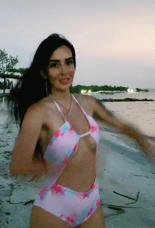 1. Sexy Adriana Valcárcel in Floral Swimsuit at the Beach (Side Boob)