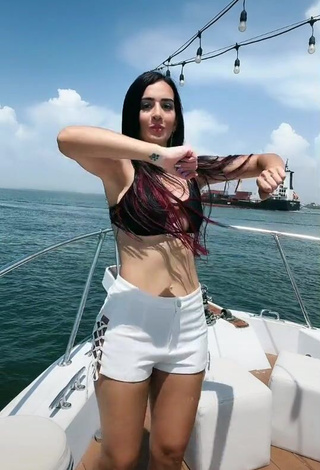 Sexy Adriana Valcárcel in Black Bikini Top on a Boat