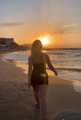 4. Sexy Alina Mour in Black Dress at the Beach