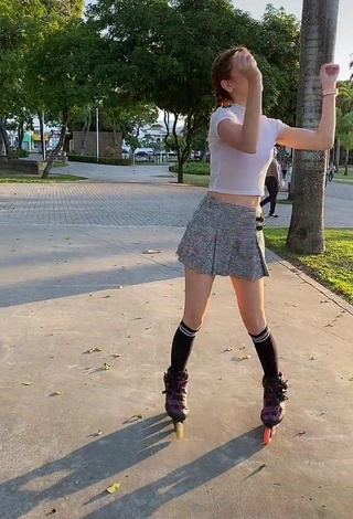 3. Cute Andressa Fontinele in White Crop Top in a Street while doing Sports Exercises