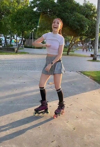 4. Cute Andressa Fontinele in White Crop Top in a Street while doing Sports Exercises