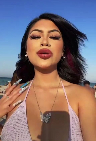 1. Hottie Desiree Montoya Shows Cleavage in Purple Bikini Top at the Beach