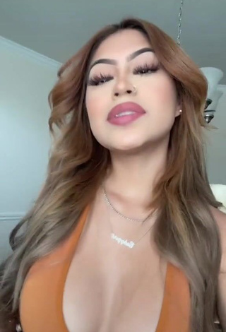 3. Desiree Montoya Shows Cleavage in Erotic Orange Crop Top