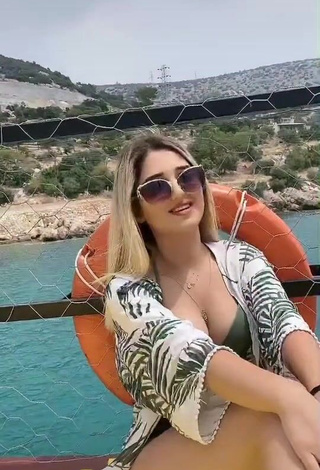 1. Hot Eda Aslankoç Shows Cleavage in Olive Bikini on a Boat