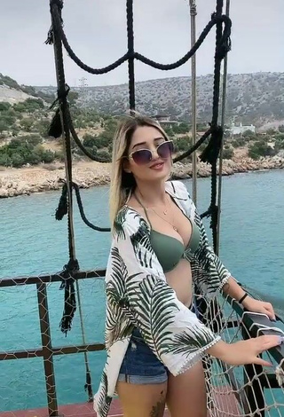 2. Sexy Eda Aslankoç Shows Cleavage in Olive Bikini Top on a Boat