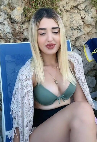 Hot Eda Aslankoç Shows Cleavage in Olive Bikini Top