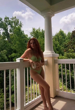 1. Beautiful Faith Collins in Sexy Green Bikini on the Balcony