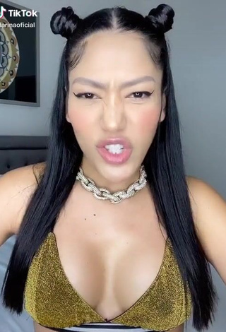 1. Sexy Farina Shows Cleavage in Golden Bikini Top