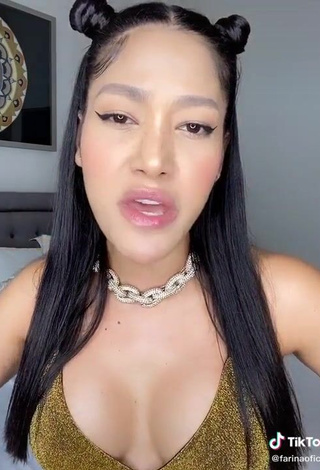 Sexy Farina Shows Cleavage in Golden Bikini Top