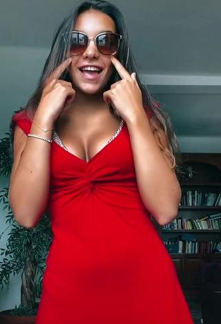 3. Hot Iris Ferrari Shows Cleavage in Red Dress