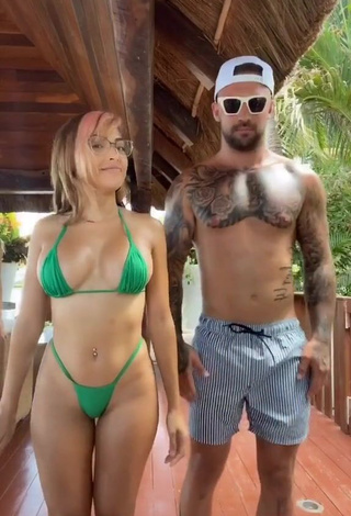 Hot Maddy Belle Shows Cleavage in Green Mini Bikini