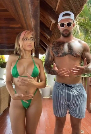 3. Hot Maddy Belle Shows Cleavage in Green Mini Bikini