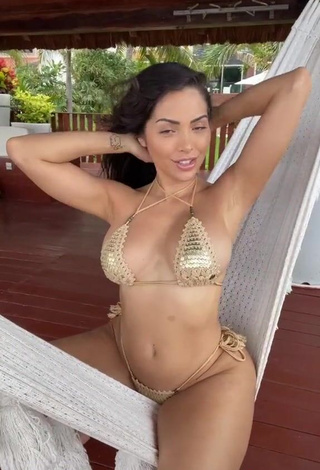 4. Cute Maddy Belle Shows Cleavage in Golden Bikini