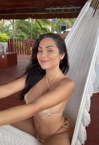 1. Lovely Maddy Belle Shows Cleavage in Golden Bikini