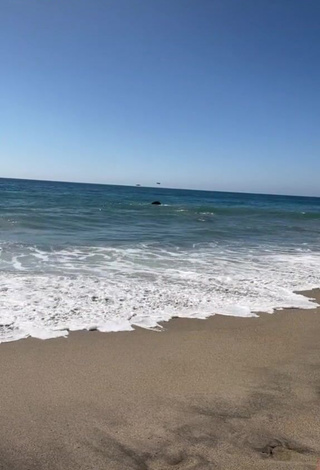 Fine Maddy Belle Shows Cleavage in Sweet Bikini at the Beach