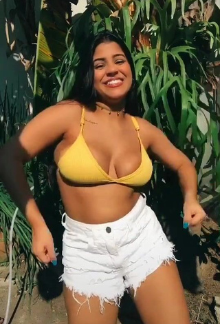 4. Sensual Julia Antunes Shows Cleavage in Yellow Bikini Top