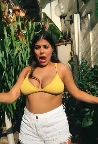 1. Erotic Julia Antunes Shows Cleavage in Yellow Bikini Top