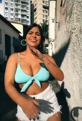 3. Breathtaking Julia Antunes Shows Cleavage in Blue Bikini Top