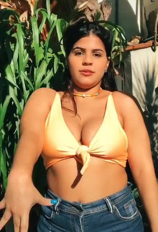 Julia Antunes Shows Cleavage in Inviting Yellow Bikini Top and Bouncing Big Tits