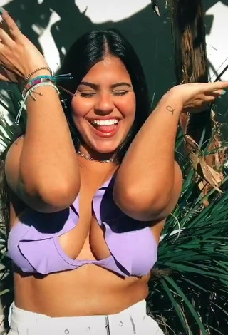 Julia Antunes Shows Cleavage in Sweet Purple Bikini Top