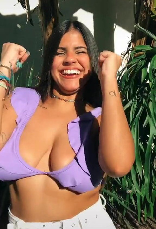 3. Wonderful Julia Antunes Shows Cleavage in Purple Bikini Top