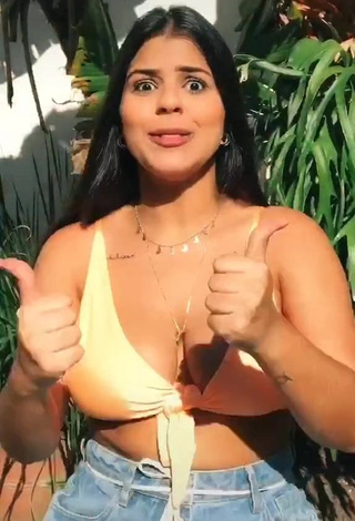 Pretty Julia Antunes Shows Cleavage in Yellow Bikini Top