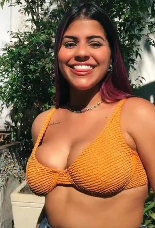 Sweetie Julia Antunes Shows Cleavage in Orange Bikini Top