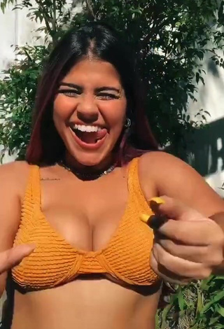 3. Sweetie Julia Antunes Shows Cleavage in Orange Bikini Top