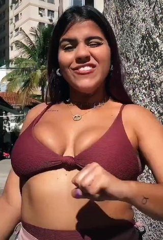 Julia Antunes Shows Cleavage in Alluring Red Bikini Top