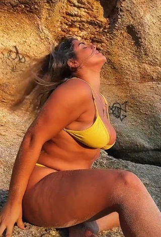 3. Seductive Julia Antunes Shows Cleavage in Yellow Bikini at the Beach