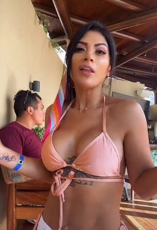 1. Erotic Kimberly Flores Shows Cleavage in Peach Bikini Top