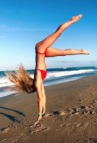 3. Hottest Olivia Dunne in Red Bikini at the Beach while doing Fitness Exercises