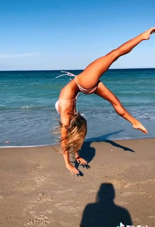 4. Alluring Olivia Dunne in Erotic White Bikini at the Beach while doing Fitness Exercises