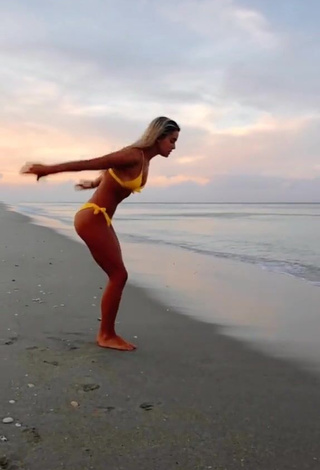 1. Hot Olivia Dunne in Yellow Bikini at the Beach while doing Fitness Exercises