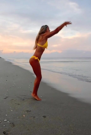 Hot Olivia Dunne in Yellow Bikini at the Beach while doing Fitness Exercises