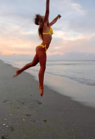 3. Hot Olivia Dunne in Yellow Bikini at the Beach while doing Fitness Exercises