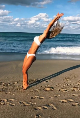 3. Lovely Olivia Dunne in White Bikini at the Beach while doing Fitness Exercises