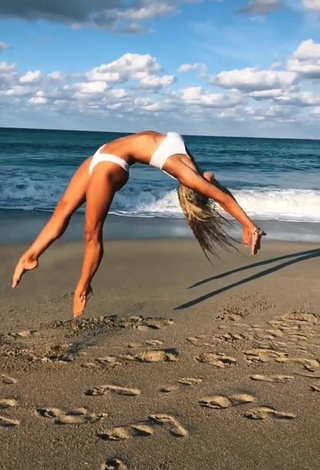 4. Lovely Olivia Dunne in White Bikini at the Beach while doing Fitness Exercises