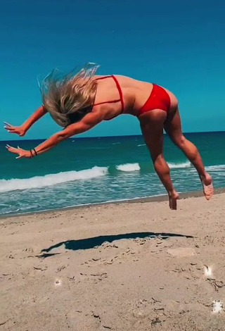 Wonderful Olivia Dunne in Red Bikini at the Beach while doing Fitness Exercises