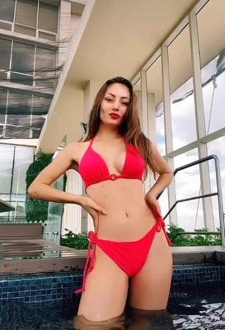 Andrea Caro Demonstrates Appealing Red Bikini and Cleavage at the Pool