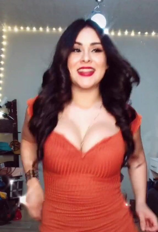 Hot Ónice Flores Shows Cleavage in Orange Dress and Bouncing Big Boobs