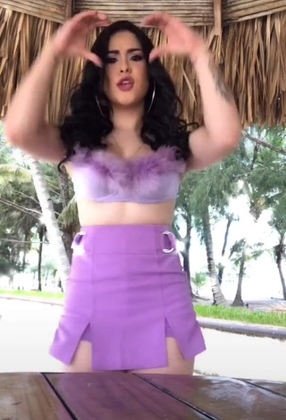 Hot Ónice Flores Shows Cleavage in Purple Crop Top