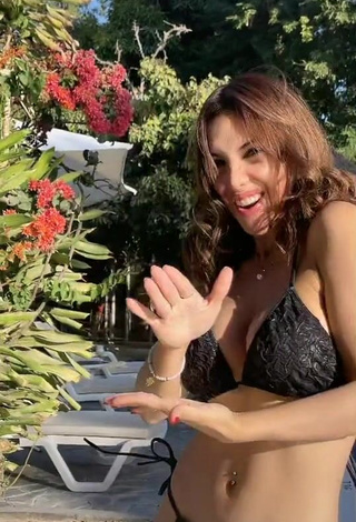 3. Cute Rosángela Espinoza Shows Cleavage in Black Bikini at the Swimming Pool