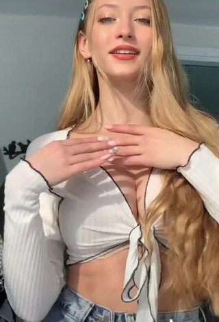 4. Seductive Sophia Diamond Shows Cleavage in White Crop Top