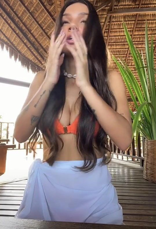 4. Hot Stéfani Bays Shows Cleavage in Orange Bikini Top