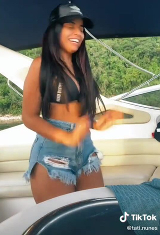 3. Sweetie Tati Nunes Shows Cleavage in Black Bikini Top on a Boat