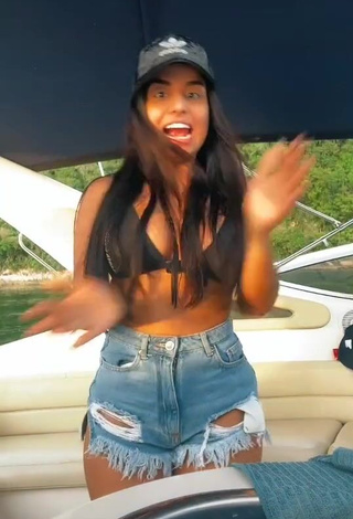 4. Sweetie Tati Nunes Shows Cleavage in Black Bikini Top on a Boat