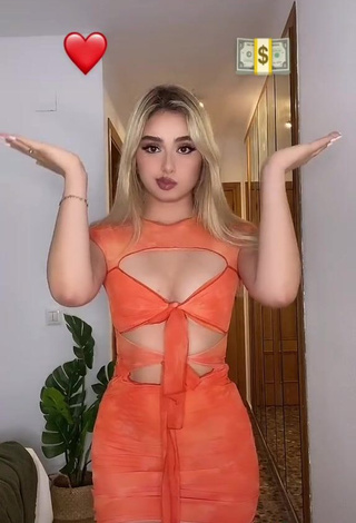 4. Beautiful Teressa Dillon Shows Cleavage in Sexy Orange Dress