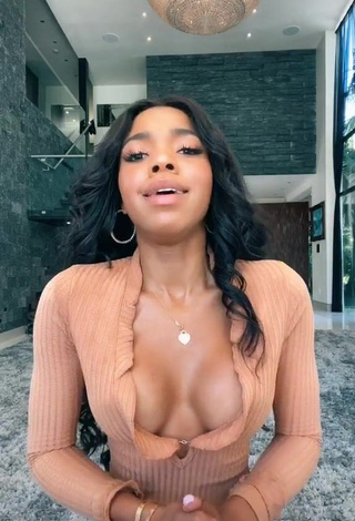 Hot Teala Dunn Shows Cleavage in Peach Top